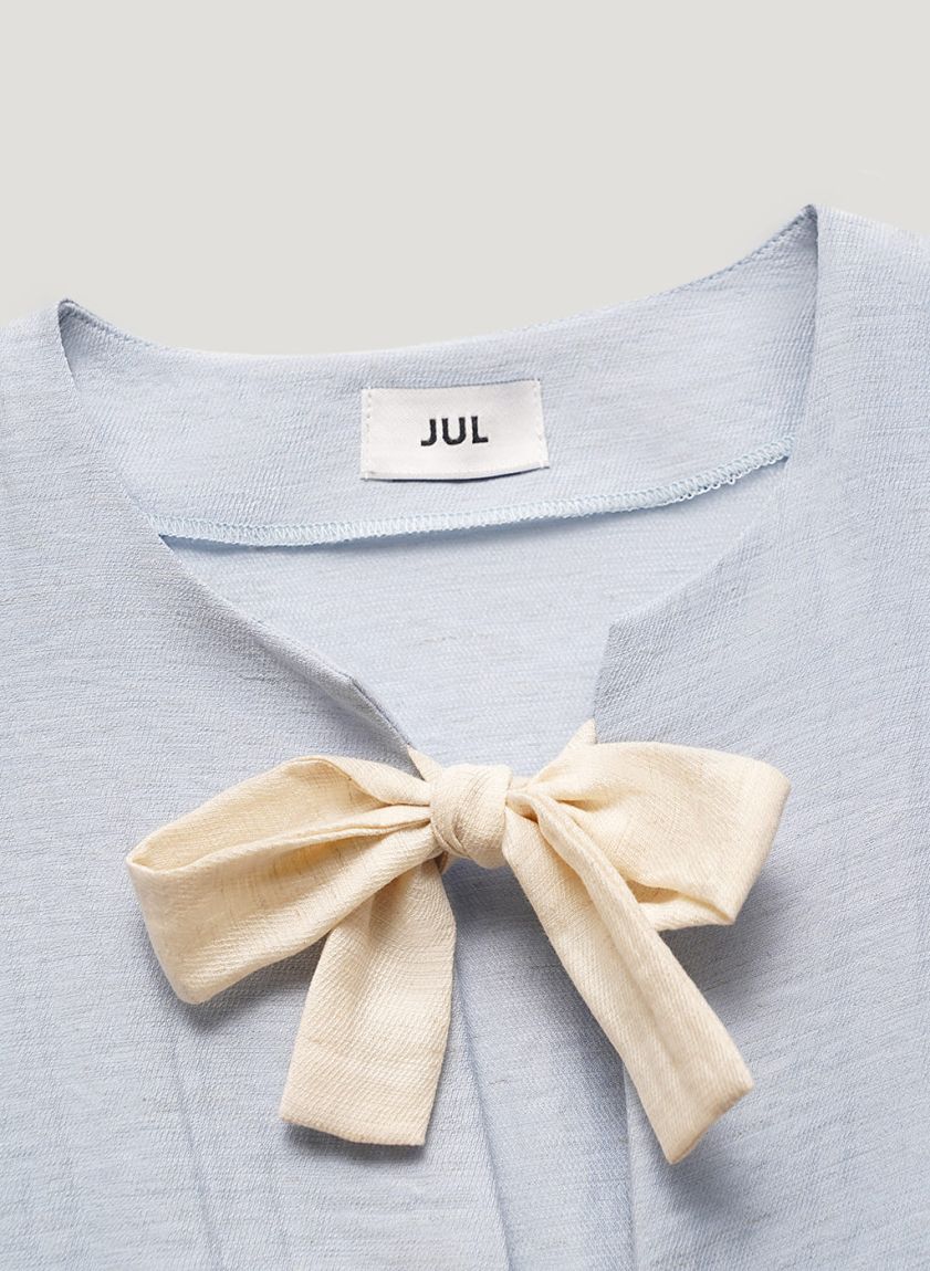 Blue blouse with bows