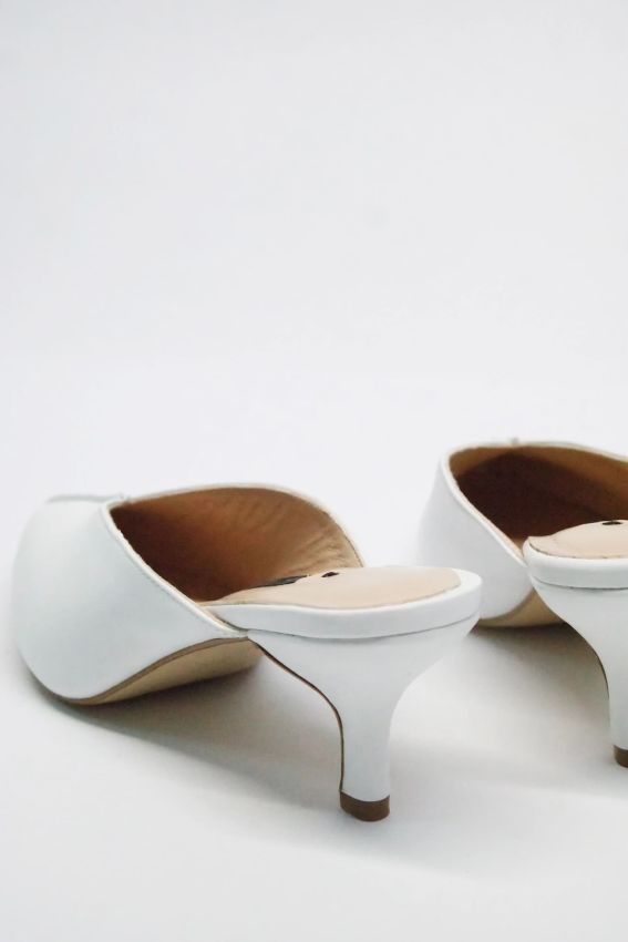 White leather mules with kitten heels