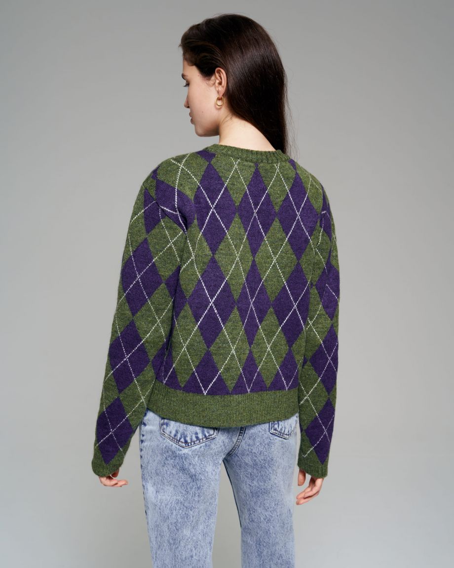 Green knitted sweater in purple rhombus
