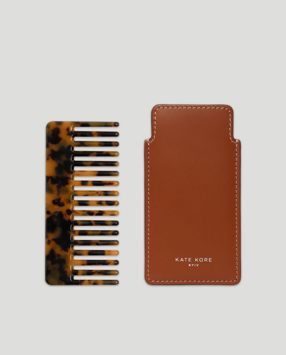 Amber hair comb with brown case