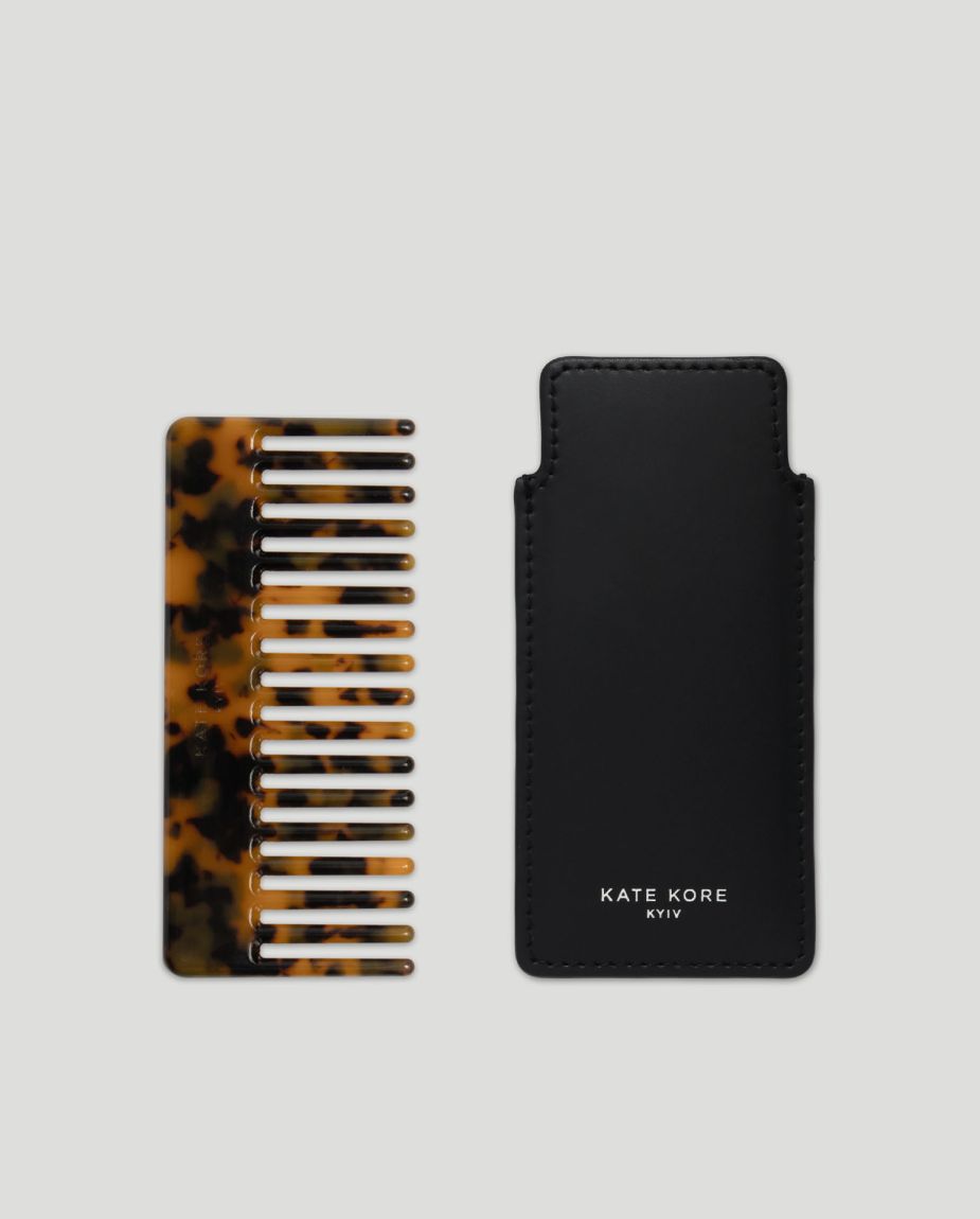 Amber hair comb with black case