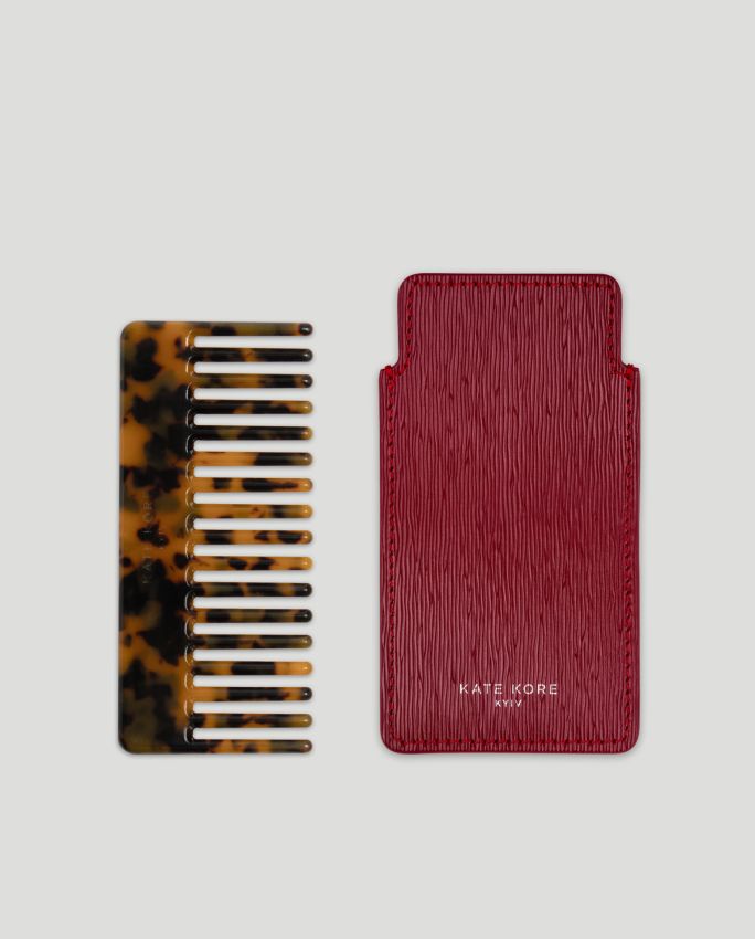 Amber hair comb with red case