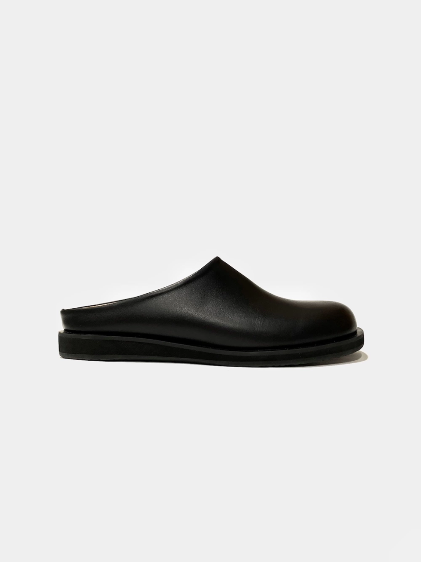 Black leather mules on a flat sole