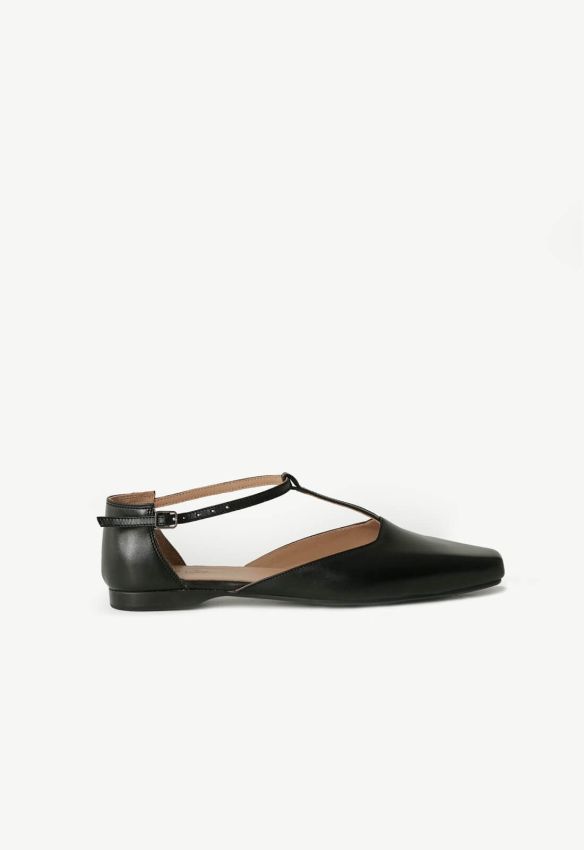 Black T-bar shoes with an elongated toe